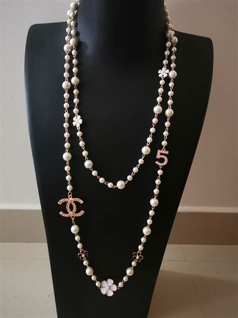 replica signature chanel pearls|Chanel knockoff pearl necklace.